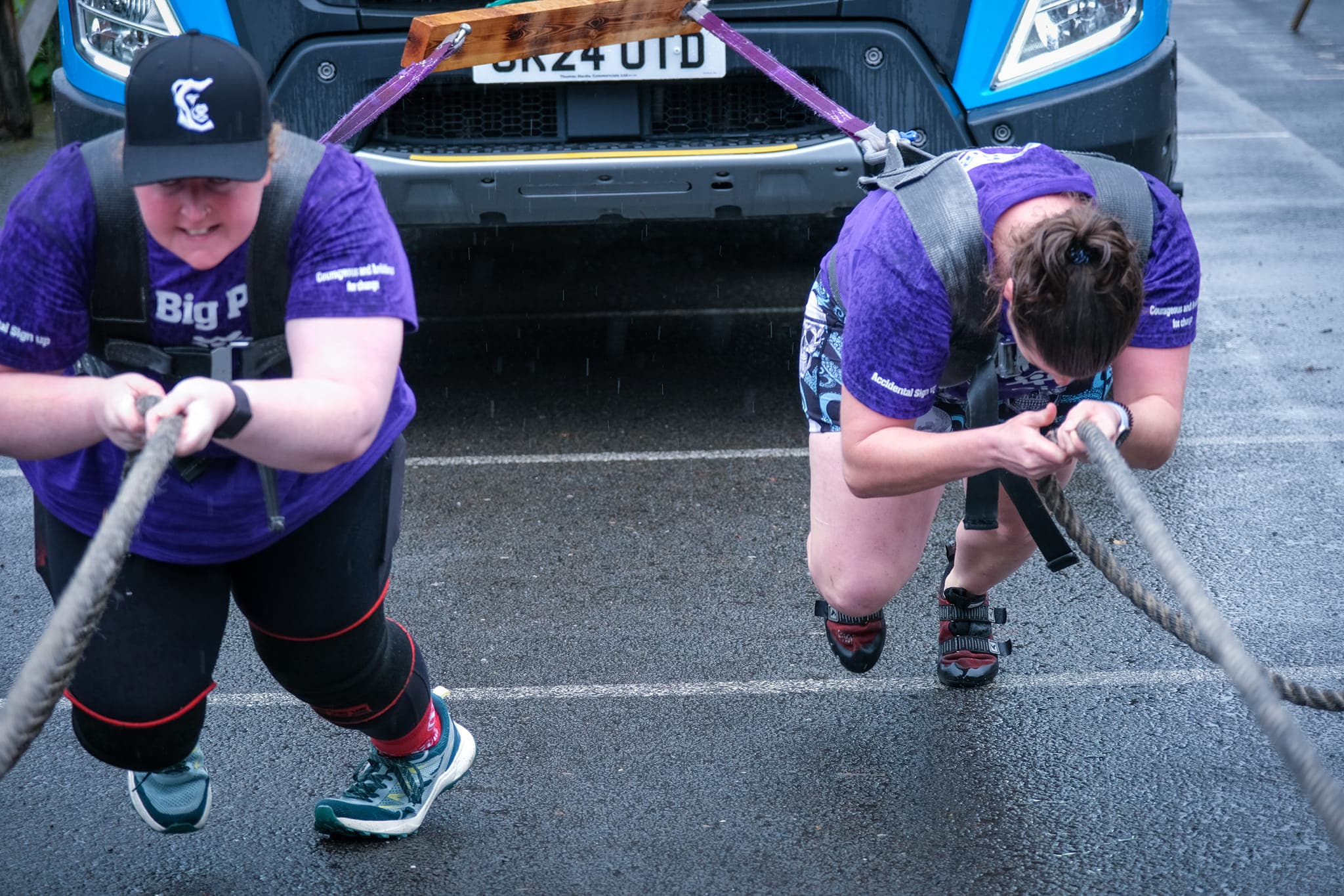Women athletes mid-truck-pull on a Big Pull for Sands